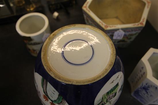 A pair of large Chinese famille verte powder blue ground jars and covers, late 19th century, 34.5cm, wood stands, one cover damaged,